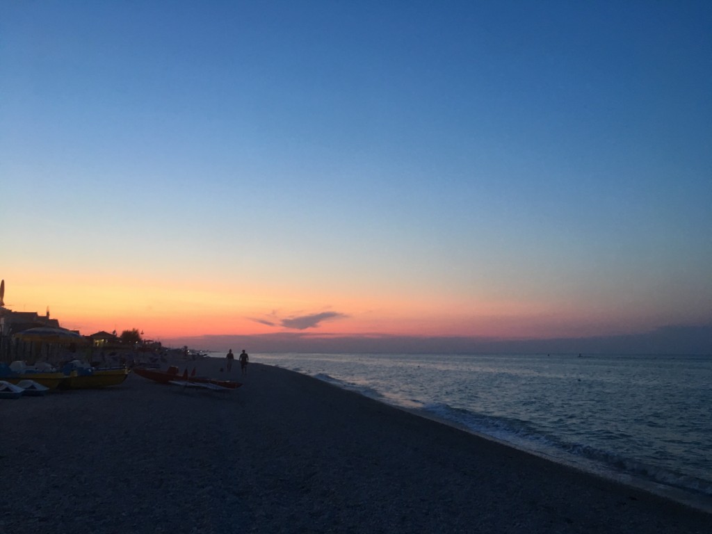 Image shows a beautiful soft sunset on a beach in the town of Marotta.