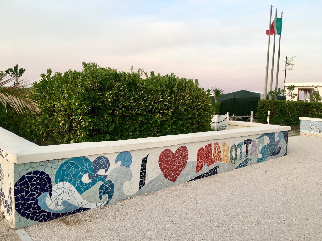 A beautiful mural in mosaic style, depicting waves and a heart, and reads "I heart Marotta"